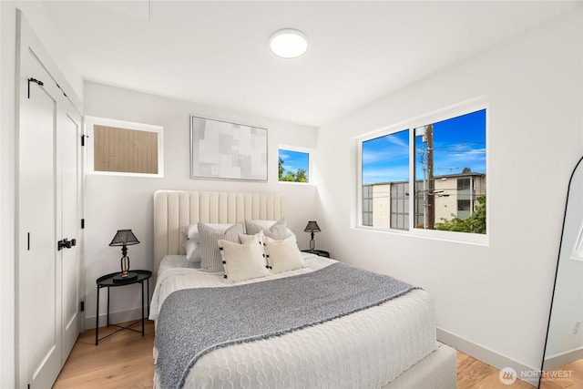 4515 44th Ave SW Unit A, Seattle, WA 98116 - bedroom featuring light wood-type flooring and baseboards
