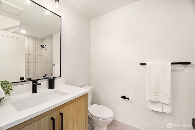 4515 44th Ave SW Unit A, Seattle, WA 98116 - full bath with toilet, vanity, a tile shower, tile patterned flooring, and baseboards