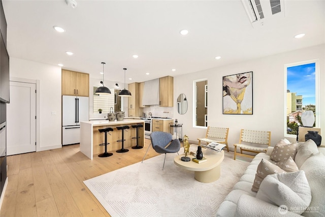 4515 44th Ave SW Unit A, Seattle, WA 98116 - living area featuring light wood finished floors and recessed lighting