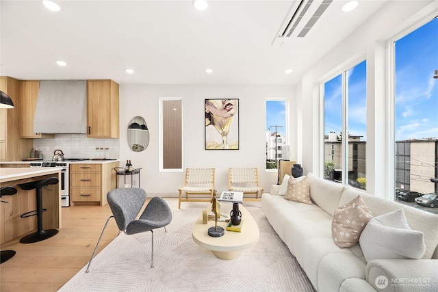 4515 44th Ave SW Unit A, Seattle, WA 98116 - living room featuring light wood-type flooring and recessed lighting