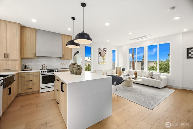 4515 44th Ave SW Unit A, Seattle, WA 98116 - kitchen with range, light brown cabinetry, modern cabinets, a kitchen island, and light countertops