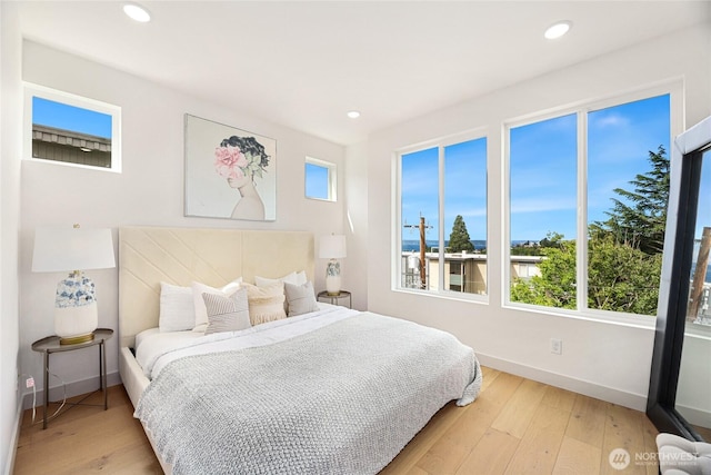 4515 44th Ave SW Unit A, Seattle, WA 98116 - bedroom featuring baseboards, light wood-style flooring, and recessed lighting