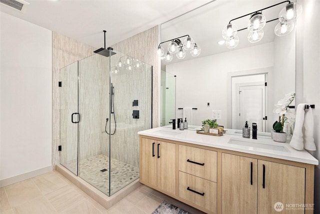 4515 44th Ave SW Unit A, Seattle, WA 98116 - bathroom featuring a shower stall, double vanity, and tile patterned flooring