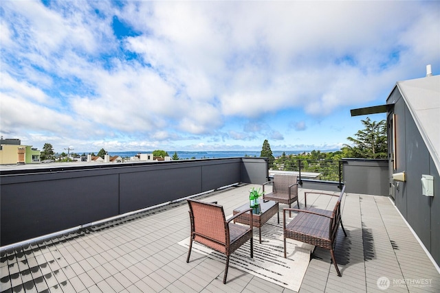 4515 44th Ave SW Unit A, Seattle, WA 98116 - view of patio / terrace with a water view and a balcony
