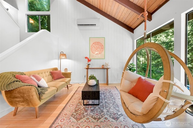 22 Bramble Way, Bellingham, WA 98229 - living area featuring a wall mounted air conditioner, a wood ceiling with exposed beams, wood finished floors, and high vaulted ceiling
