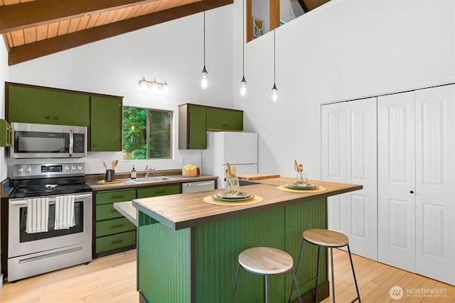 22 Bramble Way, Bellingham, WA 98229 - kitchen featuring green cabinetry, stainless steel appliances, butcher block counters, high vaulted ceiling, and beam ceiling