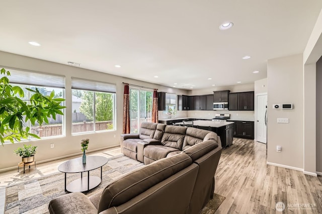 12726 36th Pl NE, Lake Stevens, WA 98258 - living area with light wood finished floors, baseboards, and recessed lighting