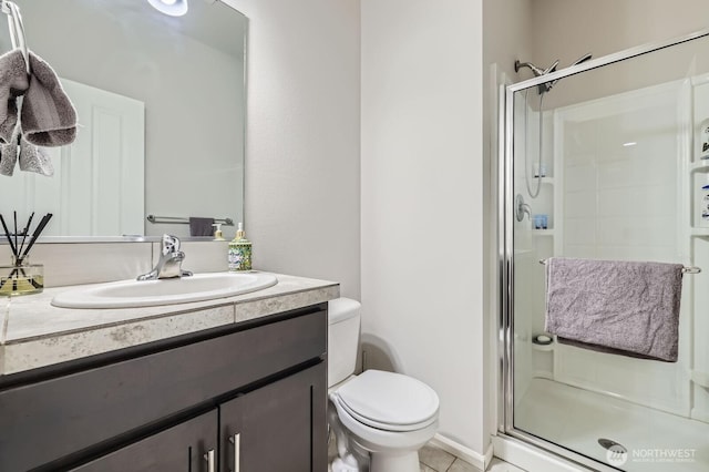 12726 36th Pl NE, Lake Stevens, WA 98258 - full bathroom featuring a shower stall, toilet, vanity, and tile patterned flooring