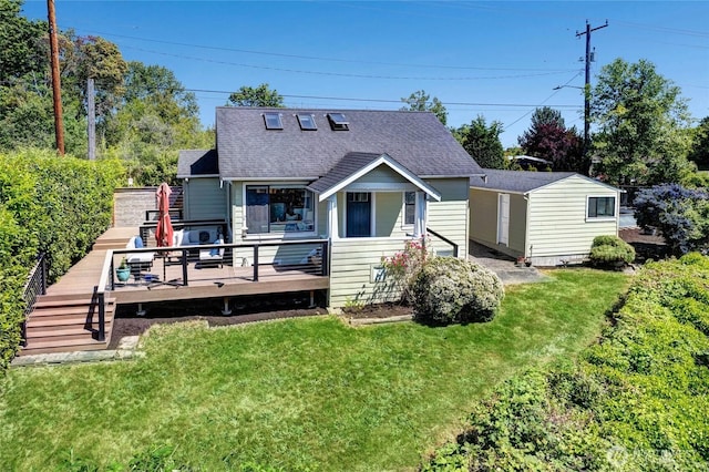 4742 22nd Ave SW, Seattle, WA 98106 - rear view of property featuring a lawn, a shingled roof, and a deck