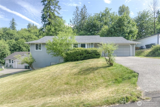 2539 123rd Ave SW, Olympia, WA 98512 - ranch-style home with an attached garage, concrete driveway, and a front lawn