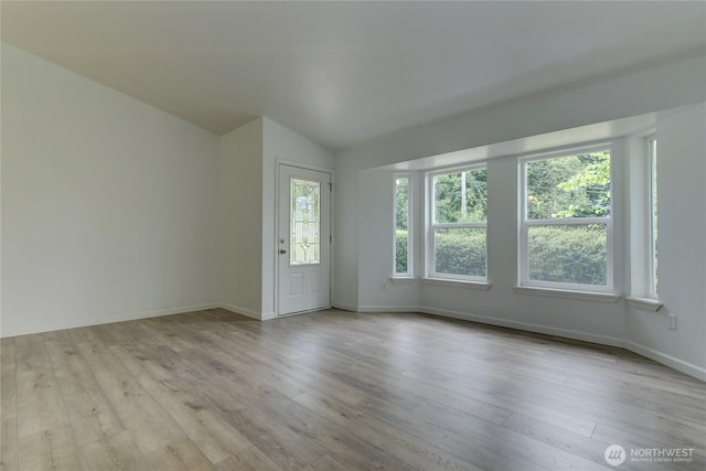 2539 123rd Ave SW, Olympia, WA 98512 - spare room with wood finished floors, lofted ceiling, and baseboards
