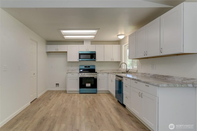 2539 123rd Ave SW, Olympia, WA 98512 - kitchen with appliances with stainless steel finishes, a sink, light countertops, and white cabinets