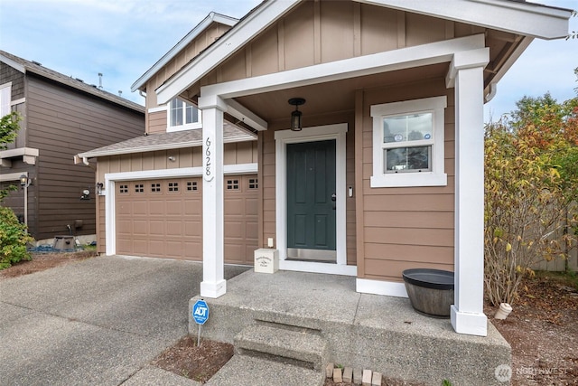 6628 Carolina St SE, Olympia, WA 98513 - property entrance featuring board and batten siding, driveway, and an attached garage