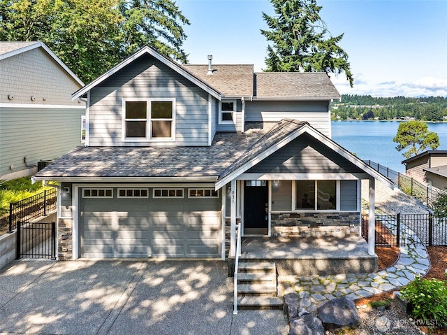 931 Oyster Bay Ct, Bremerton, WA 98312 - view of front facade featuring concrete driveway, stone siding, and a gate