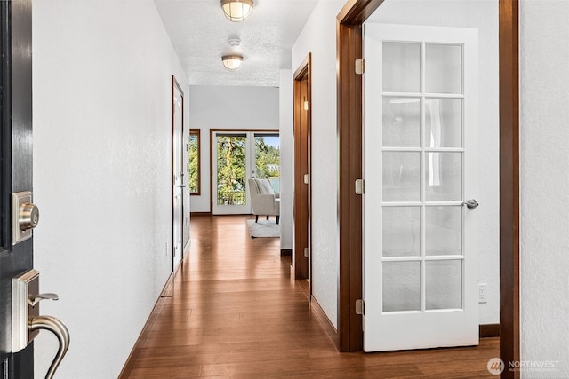 931 Oyster Bay Ct, Bremerton, WA 98312 - corridor with wood finished floors and a textured ceiling