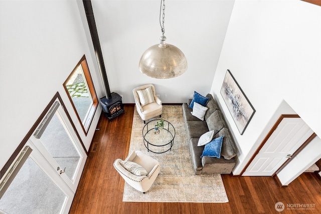 931 Oyster Bay Ct, Bremerton, WA 98312 - unfurnished room featuring a wood stove, wood finished floors, and a high ceiling