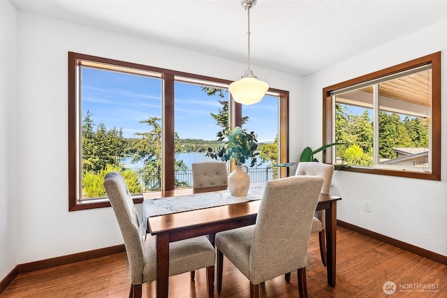 931 Oyster Bay Ct, Bremerton, WA 98312 - dining space featuring a water view, wood finished floors, and healthy amount of natural light