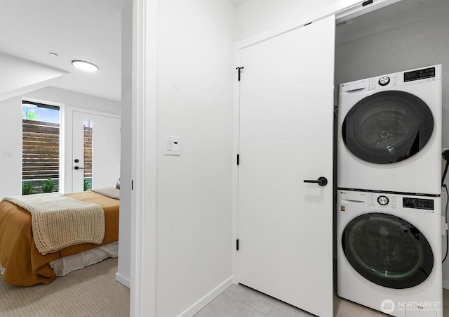 8324 16th Ave NW Unit A, Seattle, WA 98117 - washroom with stacked washer / dryer and baseboards