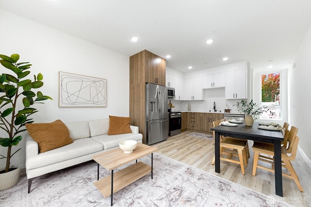 8324 16th Ave NW Unit A, Seattle, WA 98117 - living room with light wood-style flooring and recessed lighting