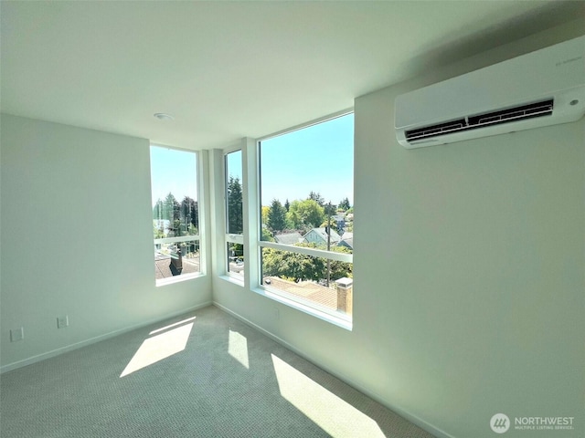 8324 16th Ave NW Unit A, Seattle, WA 98117 - unfurnished room featuring a wall mounted AC, carpet flooring, and baseboards