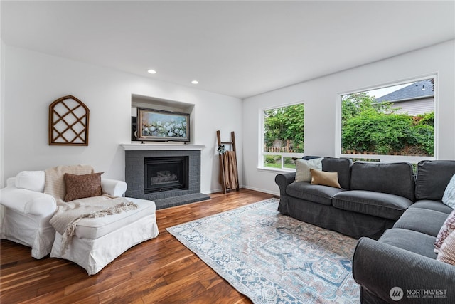 1906 Lion Pl, Wenatchee, WA 98801 - living room featuring wood finished floors, a brick fireplace, recessed lighting, and baseboards