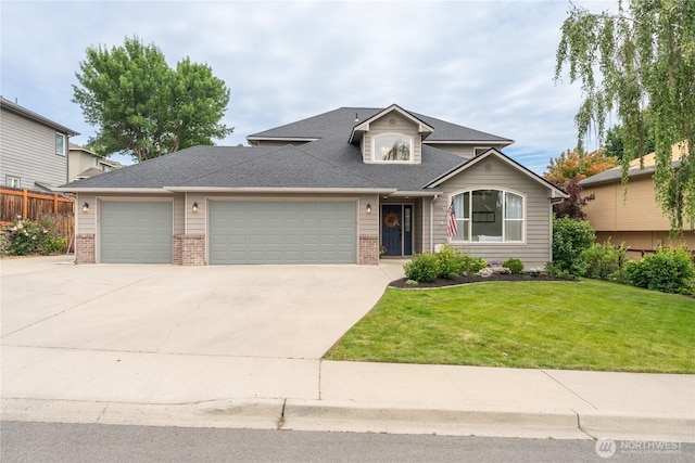 1906 Lion Pl, Wenatchee, WA 98801 - view of front of property featuring brick siding, an attached garage, and driveway