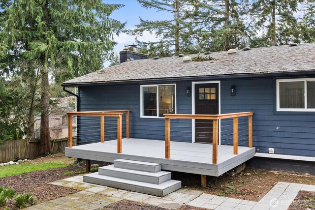 16514 Wallingford Ave N, Shoreline, WA 98133 - rear view of house with a chimney and a wooden deck