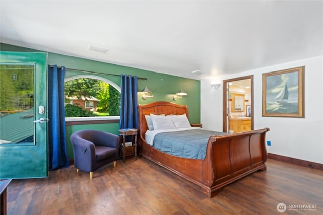 961 W Lake Samish Dr, Bellingham, WA 98229 - bedroom with wood finished floors, ensuite bath, and baseboards