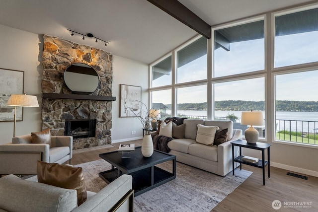 5110 NW Sammamish Rd, Issaquah, WA 98027 - living room with track lighting, baseboards, and wood finished floors