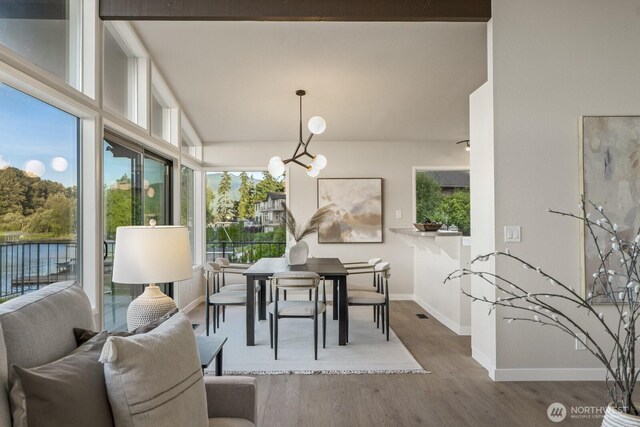 5110 NW Sammamish Rd, Issaquah, WA 98027 - dining area with baseboards, wood finished floors, and a chandelier