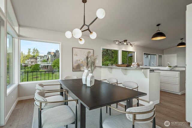 5110 NW Sammamish Rd, Issaquah, WA 98027 - dining space with healthy amount of natural light, light wood-style floors, and baseboards
