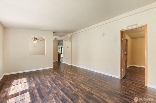 513 346th St E, Roy, WA 98580 - spare room with dark wood finished floors, ceiling fan, and baseboards