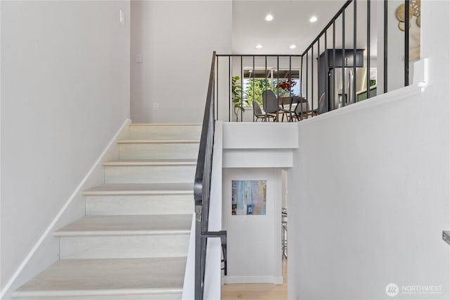 4426 NE 17th St, Renton, WA 98059 - stairs featuring recessed lighting and wood finished floors