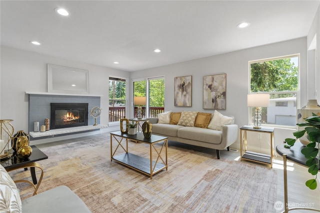 4426 NE 17th St, Renton, WA 98059 - living area with recessed lighting, plenty of natural light, a brick fireplace, and wood finished floors