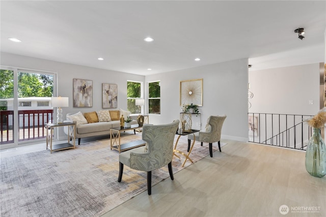 4426 NE 17th St, Renton, WA 98059 - living area with healthy amount of natural light, light wood-type flooring, recessed lighting, and baseboards