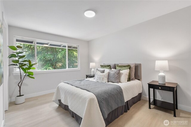 4426 NE 17th St, Renton, WA 98059 - bedroom featuring light wood-style flooring and baseboards