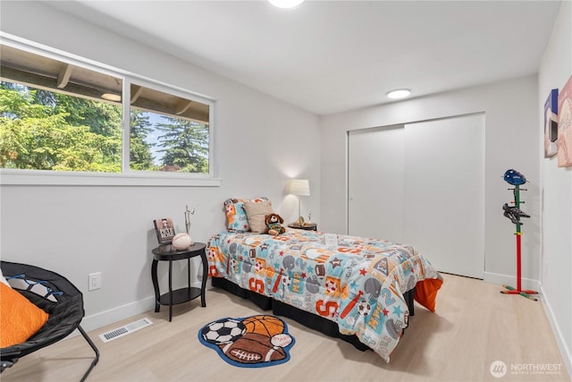 4426 NE 17th St, Renton, WA 98059 - bedroom with wood finished floors, a closet, and baseboards
