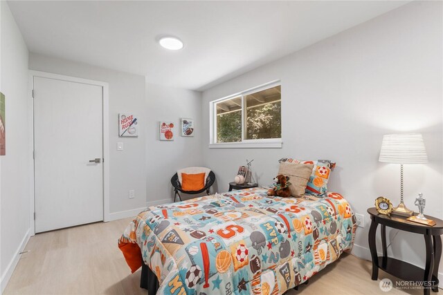 4426 NE 17th St, Renton, WA 98059 - bedroom featuring wood finished floors and baseboards
