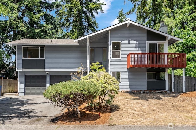 4426 NE 17th St, Renton, WA 98059 - view of front of house with a garage, a chimney, driveway, and a deck