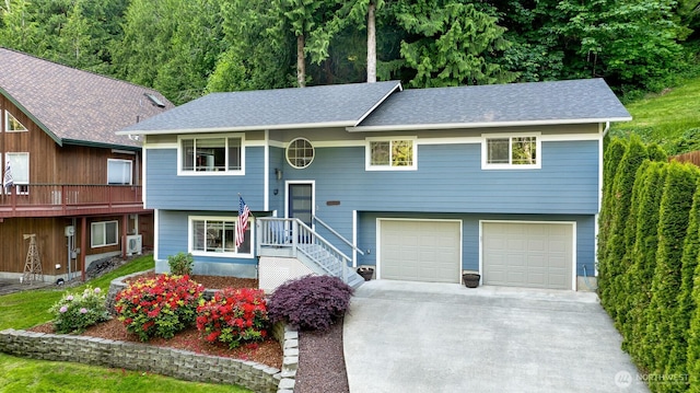 649 Summit Pl, Sedro Woolley, WA 98284 - bi-level home with a garage, driveway, and roof with shingles