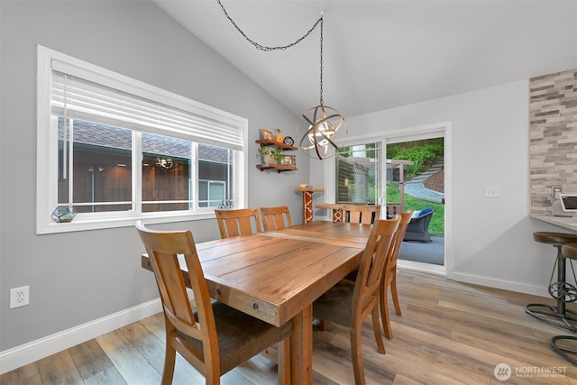 649 Summit Pl, Sedro Woolley, WA 98284 - dining room featuring vaulted ceiling, light wood finished floors, baseboards, and a chandelier