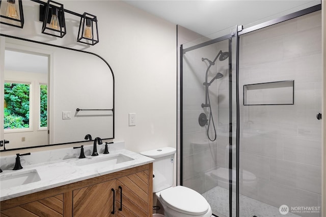 2711 Grampin Ct SE, Olympia, WA 98501 - bathroom with toilet, double vanity, and a stall shower