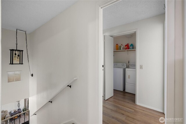2711 Grampin Ct SE, Olympia, WA 98501 - stairway with washer and dryer, wood finished floors, and baseboards