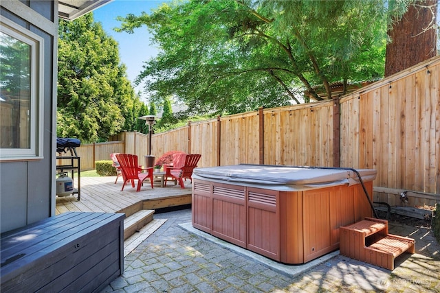 2711 Grampin Ct SE, Olympia, WA 98501 - fenced backyard with a hot tub, a patio, and a deck