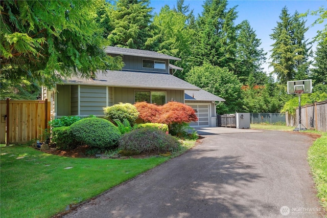 2711 Grampin Ct SE, Olympia, WA 98501 - view of front of home featuring driveway, roof with shingles, and an attached garage