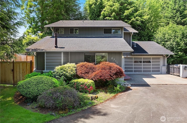 2711 Grampin Ct SE, Olympia, WA 98501 - view of front of house with driveway, a garage, and a shingled roof
