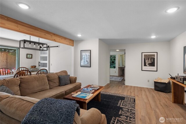 2711 Grampin Ct SE, Olympia, WA 98501 - living area with light wood-type flooring, recessed lighting, plenty of natural light, baseboards, and beamed ceiling