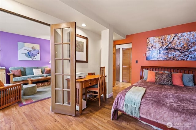 2700 4th Ave Unit 403, Seattle, WA 98121 - bedroom with light wood finished floors and recessed lighting