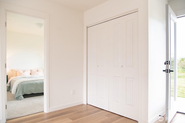 1022 Peach Rd, Winlock, WA 98596 - bedroom with light wood-type flooring, a closet, and baseboards