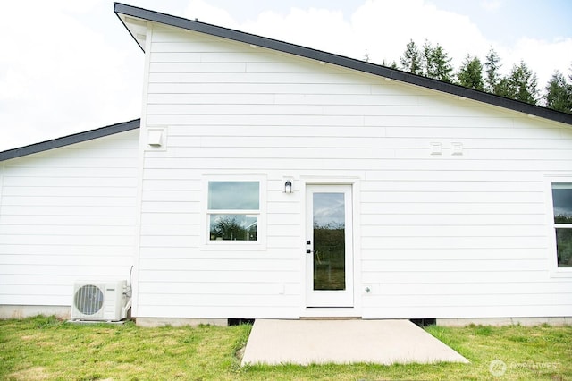 1022 Peach Rd, Winlock, WA 98596 - back of property featuring a cooling unit and a yard